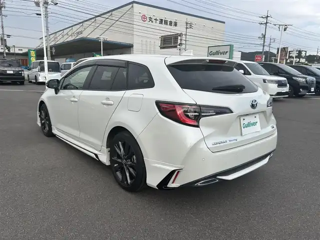 トヨタ カローラツーリング ハイブリッド ダブルバイビー 岡山県 2020(令2)年 7.4万km ホワイトパールクリスタルシャイン 登録時走行距離73409km/モデリスタフルエアロ/純正8インチナビ/フルセグTV(AM.FM.CD.DVD.TV.BT)/バックカメラ/トヨタセーフティセンス/・プリクラッシュセーフティ/・レーンキープアシスト/・レーダークルーズコントロール/・オートマチックハイビーム/ヘッドアップディスプレイ/ビルトインETC/シートヒーター/ステアリングヒーター/クリアランスソナー/オートブレーキホールド/横滑り防止装置/オートライト/アイドリングストップ/USB入力端子/プッシュスタート/17インチ純正AW/純正フロアマット/LEDヘッドライト
