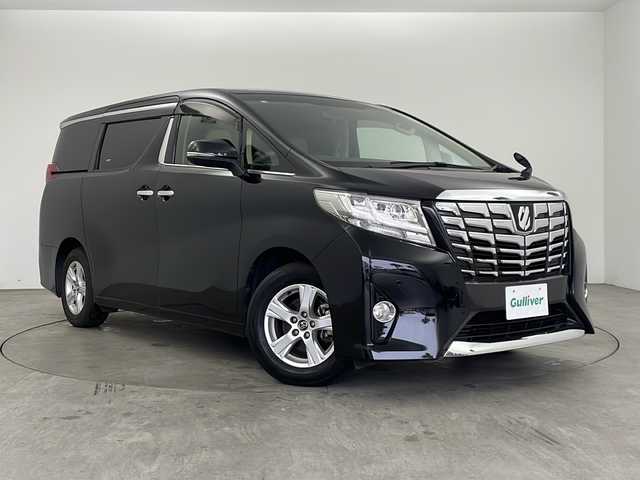 トヨタ アルファード X 兵庫県 2016(平28)年 6.9万km ブラック ・純正9インチナビ/CD/DVD/TV/Bluetooth/SD/・純正リアフリップダウンモニター/・バックカメラ/・両側パワースライドドア/・前後コーナーセンサー/・オートライト/・LEDヘッドライト/・オートブレーキホールド/・AC100V電源/・MTモード付AT/・WACエアコン/・純正アルミホイール/・純正フロアマット/・横滑り防止機能/・盗難防止装置/・三列シート/・チップアップシート/・W＋サイドエアバック/・カーテンエアバック/・ビルドインETC/・スマートキー/・スペアキー/・プッシュスタート