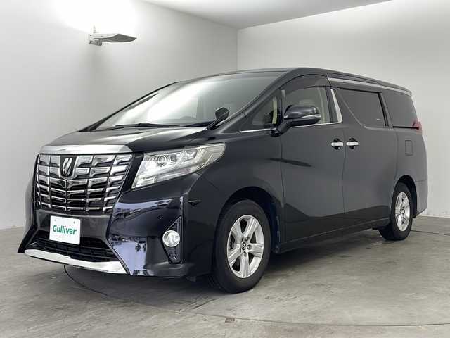 トヨタ アルファード X 兵庫県 2016(平28)年 6.9万km ブラック ・純正9インチナビ/CD/DVD/TV/Bluetooth/SD/・純正リアフリップダウンモニター/・バックカメラ/・両側パワースライドドア/・前後コーナーセンサー/・オートライト/・LEDヘッドライト/・オートブレーキホールド/・AC100V電源/・MTモード付AT/・WACエアコン/・純正アルミホイール/・純正フロアマット/・横滑り防止機能/・盗難防止装置/・三列シート/・チップアップシート/・W＋サイドエアバック/・カーテンエアバック/・ビルドインETC/・スマートキー/・スペアキー/・プッシュスタート