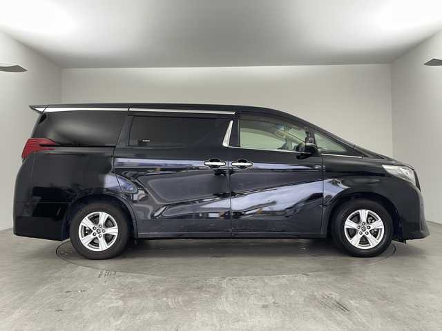 トヨタ アルファード X 兵庫県 2016(平28)年 6.9万km ブラック ・純正9インチナビ/CD/DVD/TV/Bluetooth/SD/・純正リアフリップダウンモニター/・バックカメラ/・両側パワースライドドア/・前後コーナーセンサー/・オートライト/・LEDヘッドライト/・オートブレーキホールド/・AC100V電源/・MTモード付AT/・WACエアコン/・純正アルミホイール/・純正フロアマット/・横滑り防止機能/・盗難防止装置/・三列シート/・チップアップシート/・W＋サイドエアバック/・カーテンエアバック/・ビルドインETC/・スマートキー/・スペアキー/・プッシュスタート