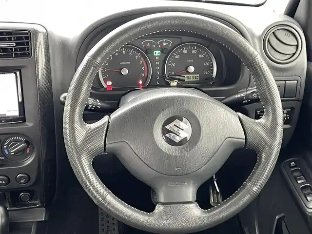 スズキ ジムニー クロスアドベンチャー XC 熊本県 2011(平23)年 10.7万km クエーサーグレーメタリック 禁煙車　/社外ナビ　/ＥＴＣ　/運転席シートヒーター　/電動格納ミラー　/純正フロアマット　/純正１６インチＡＷ　/ＬＥＤヘッドライト