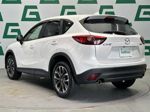 マツダ ＣＸ－５ 25S Lパッケージ 鹿児島県 2015(平27)年 3.7万km クリスタルホワイトパールマイカ BOSEプレミアムサウンド/ブラインドスポットモニタリング/全車速追従機能付マツダレーダークルーズコントロール/アドバンストスマートシティブレーキサポート/AT誤発進抑制制御［前進時/後退時］/アダプティブLEDヘッドライト/レーンキープアシストシステム/交通標識認識システム/純正SDナビ/（CD/DVD/フルセグ/Bluetooth/AUX）/ETC/革巻きステアリング/ステアリングリモコン/前席パワーシート/前席シートヒーター/運転席シートメモリ/前後クリアランスソナー/純正LEDヘッドライト/フロントフォグランプ/オートライト/電動パーキングブレーキ/トノカバー/純正フロアマット/純正19インチアルミ/純正ドアバイザー