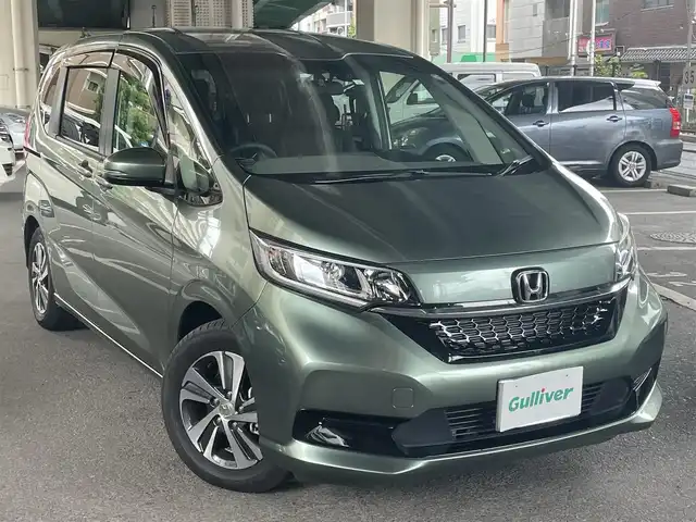 ホンダ フリード G 鹿児島県 2023(令5)年 0.2万km シルバーミストグリーンM ホンダセンシング/・衝突軽減ブレーキ/・歩行者事故低減ステアリング/・アダプティブクルーズコントロール/・車線維持支援システム/・誤発進抑制機能/・先行車発進お知らせ機能/・マルチインフォメーションディスプレイ/純正ナビ/・Bluetooth/・フルセグTV/・バックカメラ/純正15インチアルミホイール/両側パワースライドドア/インパネセンターテーブル/LEDヘッドライト/・オートライト/シートヒーター/ワンオーナー/新車保証書/取扱説明書
