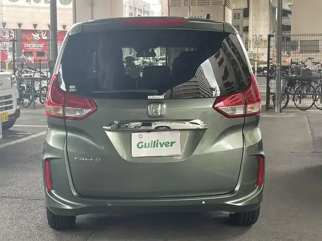 ホンダ フリード G 鹿児島県 2023(令5)年 0.2万km シルバーミストグリーンM ホンダセンシング/・衝突軽減ブレーキ/・歩行者事故低減ステアリング/・アダプティブクルーズコントロール/・車線維持支援システム/・誤発進抑制機能/・先行車発進お知らせ機能/・マルチインフォメーションディスプレイ/純正ナビ/・Bluetooth/・フルセグTV/・バックカメラ/純正15インチアルミホイール/両側パワースライドドア/インパネセンターテーブル/LEDヘッドライト/・オートライト/シートヒーター/ワンオーナー/新車保証書/取扱説明書