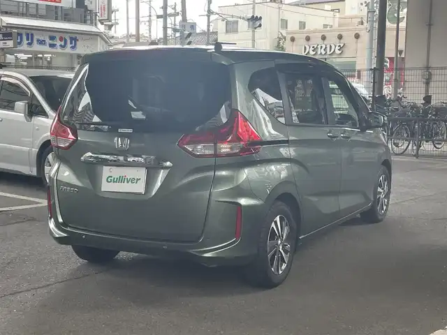 ホンダ フリード G 鹿児島県 2023(令5)年 0.2万km シルバーミストグリーンM ホンダセンシング/・衝突軽減ブレーキ/・歩行者事故低減ステアリング/・アダプティブクルーズコントロール/・車線維持支援システム/・誤発進抑制機能/・先行車発進お知らせ機能/・マルチインフォメーションディスプレイ/純正ナビ/・Bluetooth/・フルセグTV/・バックカメラ/純正15インチアルミホイール/両側パワースライドドア/インパネセンターテーブル/LEDヘッドライト/・オートライト/シートヒーター/ワンオーナー/新車保証書/取扱説明書