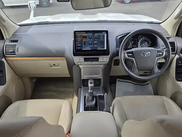 トヨタ ランドクルーザー プラド TX Lパッケージ 鹿児島県 2019(平31)年 6.7万km ホワイトパールクリスタルシャイン ムーンルーフ　/モデリスタエアロ（リア／フロント）　/ルーフレール　/ＡＬＰＩＮＥナビ　/Ｂｌｕｅｔｏｏｔｈオーディオ　/バックカメラ　/Ｄ＋Ｎ席シートヒーター　/Ｄ＋Ｎ席シートベンチレーション/D+N席パワーシート　/ビルトインＥＴＣ/前方ドライブレコーダー/前後コーナーセンサー/レーダークルーズコントロール/純正アルミホイール(19インチ)/横滑り防止装置/レーンキープアシスト/プッシュスタート/スマートキー/エアバッグ(W+サイド)/カーテンエアバッグ