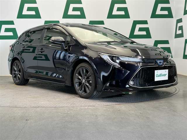 トヨタ カローラツーリング ハイブリッド ダブルバイビー 鹿児島県 2020(令2)年 2万km スパークリングブラックパールクリスタルシャイン 純正ディスプレイオーディオ/(フルセグ/AppleCarPlay/AndroidAuto)/前方ドライブレコーダー/バックカメラ/ビルトインETC/Toyota Sefety Sense/　・プリクラッシュセーフティ/　・レーントレーシングアシスト/　・全車速追従機能付レーダークルーズコントロール/　・オートマチックハイビーム/　・ロードサインアシスト/ブラインドスポットモニター/電動パーキングブレーキ/オートブレーキホールド/本革巻きステアリング/純正アルミホイール/純正フロアマット/LEDヘッドライト