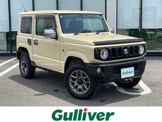スズキ ジムニー XC 岐阜県 2023(令5)年 1.2万km シフォンアイボリーM ワンオーナー/4WDターボ/純正8インチSDナビ /フルセグテレビ /バックカメラ　/デュアルセンサーブレーキサポート　/エマージェンシーストップシグナル/LEDヘッドライト　/クルーズコントロール/サイドエアロ　/スマートキー　/シートヒーター前席　/ドライブレコーダー前後　/ビルトインETC/プッシュスタート/保証書/取扱説明書/Blue tooth接続/CDチェンジャー/USB入力端子/iPod接続/フルフラットシート/社外フロアマット/純正16アルミホイール/横滑り防止装置/レーンキープアシスト/オートライト/ダウンヒルアシストコントロール/エアバッグW＋サイド/衝突被害軽減システム/ドアバイザー/ボンネットバイザー/サイドアンダーミラー/ミラーヒーター/ウィンカーミラー/給油口ガラスリッド/リアステップラダー/UVカット機能付きガラス