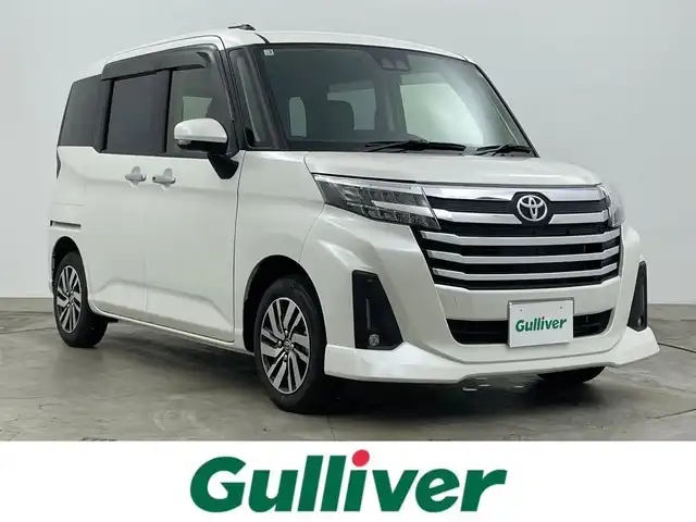 トヨタ ルーミー カスタムG 岡山県 2025(令7)年 0.1万km パールホワイトⅢ 衝突軽減ブレーキ/追従型クルーズコントロール/9インチディスプレイオーディオ/【Bluetooth/フルセグTV/HDMI/Carplay】/前席シートヒーター/バックカメラ/ＬＥＤヘッドライト＆LEDフォグランプ/オートハイビーム/オートブレーキホールド/アイドリングストップ/プッシュスタート/純正フロアマット/コーナーセンサー（前後）/踏み間違い防止/横滑り防止/ISOFIX/ステアリングスイッチ/シートリフター/シートバックテーブル/ウインカーミラー/ドアバイザー/両側パワースライドドア/新車保証書/取扱説明書/スマートキー×2