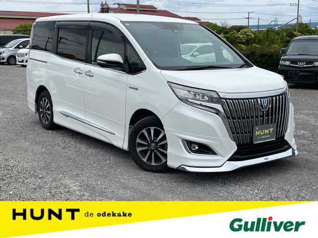 トヨタ エスクァイア ハイブリッド Gi プレミアムパッケージ 千葉県 2017(平29)年 12.2万km ホワイトパールクリスタルシャイン 純正９インチナビ　/【型式：NSZT-Y66T】/トヨタセーフティセンス/ラジオ/CD/DVD/Ｂｌｕｅｔｏｏｔｈ/フルセグTV　/バックカメラ　/ビルトインＥＴＣ　/モデリスタエアロ　/フリップダウンモニター　/両側パワースライドドア　/スマートキー　/ハーフレザーシート　/D/N席シートヒーター/純正フロアマット/純正アルミホイール