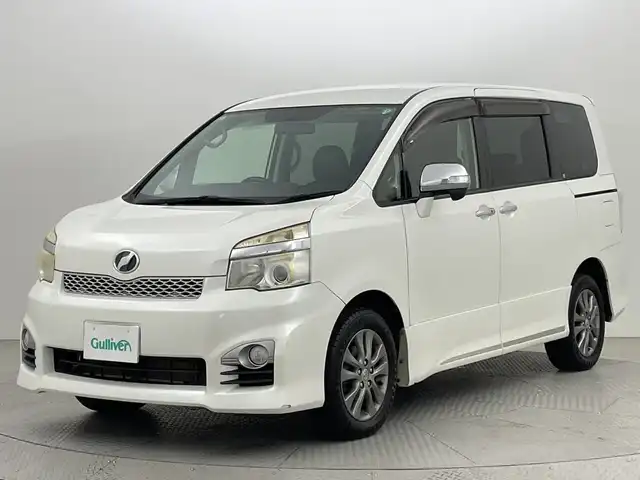 トヨタ ヴォクシー ZS 煌Z 新潟県 2013(平25)年 7.3万km ホワイトパールクリスタルシャイン ４WD/ワンオーナー/純正SDナビ/　　CD/DVD/AM/FM/フルセグ/BT/バックモニター/両側パワースライドドア/純正15インチアルミホイール付/パドルシフト/リアオートエアコン/センターデフロック/フロアマット/ドアバイザー/電動格納ミラー/ステアリングスイッチ/スペアキー/スマートキー