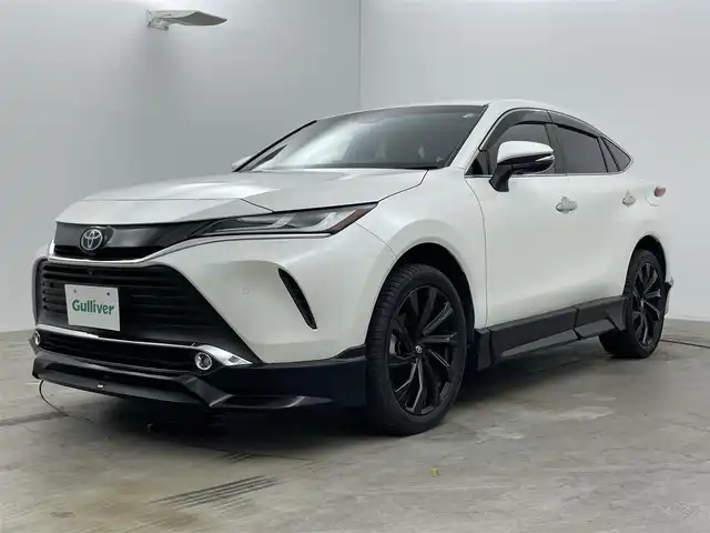 トヨタ ハリアー ハイブリッド Z レザーパッケージ 岡山県 2020(令2)年 5.4万km ホワイトパールクリスタルシャイン ＧＲエアロ（F/S/R)/ＧＲ２０インチAW(245/45R20)/ＪＢＬプレミアムサウンド/TRDマフラー/スターターリモコン（取扱説明書付き）/純正１２．３インチディスプレイオーディオ/【ナビ/Bluetooth/フルセグTV/Carplay/AUX/USB】/ブラックレザーシート/プリクラッシュセーフティ/パノラミックビューモニター/ビルトインＥＴＣ２．０/オートハイビーム/ＬＥＤヘッドライト/前席シートヒーター/前席エアシート/ステアリングヒーター/前席パワーシート/シートメモリー/社外20インチアルミホイール/純正フロアマット/コーナーセンサー（前後）/スマートキー×２/新車保証書/取扱説明書