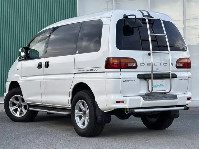 三菱 デリカ スペースギア XR 福岡県 1997(平9)年 8.1万km ソフィアホワイト コーナーセンサー（前後）/片側パワースライド/レザーシート/ベンチシート/3列シート/純正AW/純正フロアマット/ワンセグTV/バックカメラ/ETC/CD・CDチェンジャー/後席モニター/AAC/リモコンキー/ターボ