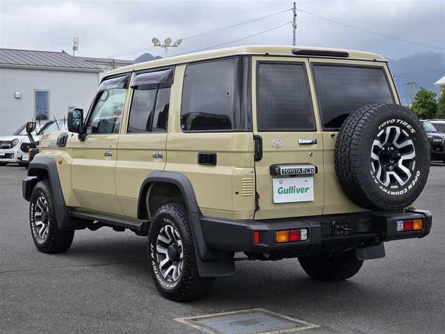 トヨタ ランドクルーザー AX 鹿児島県 2024(令6)年 1万km ベージュ クルーズコントロール　/ＥＴＣ　/純正ＳＤナビ（ＮＭＺＫ－Ｗ７３Ｄ）　/Ｂｌｕｅｔｏｏｔｈオーディオ　/テレビキャンセラー　/ヒルディセントコントロール　/前後ドライブレコーダー　/ＭＴモード付きＡＴ/トヨタセーフティセンス/プリクラッシュセーフティ/ドライブスタートコントロール/横滑り防止装置/レーンキープアシスト/純正アルミホイール(16インチ)/フルセグテレビ