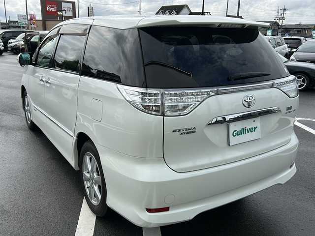 トヨタ エスティマ ハイブリッド G 岐阜県 2010(平22)年 10.7万km ホワイトパールクリスタルシャイン 登録時走行距離106836km/純正ナビ　/フリップダウンモニター　/クルーズコントロール　/バックカメラ　/盗難防止装置　/コーナーセンサー　/アイドリングストップ　/両側パワースライド　/シートヒーター　/パワーシート　/オートライト　/スマートキー/プッシュスタート/純正17インチアルミホイール/フロアマット/4WD
