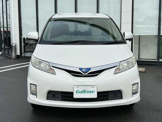 トヨタ エスティマ ハイブリッド G 岐阜県 2010(平22)年 10.7万km ホワイトパールクリスタルシャイン 登録時走行距離106836km/純正ナビ　/フリップダウンモニター　/クルーズコントロール　/バックカメラ　/盗難防止装置　/コーナーセンサー　/アイドリングストップ　/両側パワースライド　/シートヒーター　/パワーシート　/オートライト　/スマートキー/プッシュスタート/純正17インチアルミホイール/フロアマット/4WD