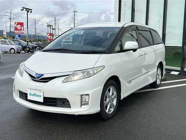 トヨタ エスティマ ハイブリッド G 岐阜県 2010(平22)年 10.7万km ホワイトパールクリスタルシャイン 登録時走行距離106836km/純正ナビ　/フリップダウンモニター　/クルーズコントロール　/バックカメラ　/盗難防止装置　/コーナーセンサー　/アイドリングストップ　/両側パワースライド　/シートヒーター　/パワーシート　/オートライト　/スマートキー/プッシュスタート/純正17インチアルミホイール/フロアマット/4WD