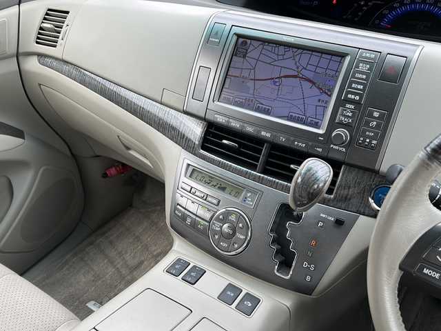 トヨタ エスティマ ハイブリッド G 岐阜県 2010(平22)年 10.7万km ホワイトパールクリスタルシャイン 登録時走行距離106836km/純正ナビ　/フリップダウンモニター　/クルーズコントロール　/バックカメラ　/盗難防止装置　/コーナーセンサー　/アイドリングストップ　/両側パワースライド　/シートヒーター　/パワーシート　/オートライト　/スマートキー/プッシュスタート/純正17インチアルミホイール/フロアマット/4WD