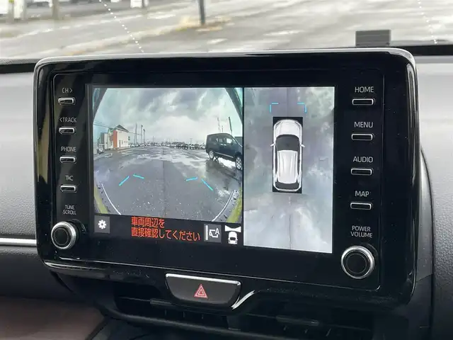 トヨタ ヤリスクロス ハイブリッド Z 道央・札幌 2021(令3)年 2.8万km ブラスゴールドメタリック ４WD/純正ディスプレイオーディオ（ナビ付）/AM/FM/USB/BT/トヨタセーフティセンス/横滑り防止装置/レーダークルーズコントロール/ダウンヒルアシストコントロール/レーンキープアシスト/パーキングアシスト/クリアランスソナー/ブラインドスポットモニター/リアクロストラフィックアラート/パーキングサポートブレーキ/ロードサインアシスト/パノラミックビューモニター/ビルトインETC2.0/ドライブレコーダー/EVMODE/DRIVEMODE切替/D席パワーシート/前席シートヒーター/ハーフレザーシート/革巻きステアリング/ステアリングリモコン/電動パーキング/ブレーキホールド/レーダー探知機/プッシュスタート/スマートキー/LEDヘッドライト/オートライト/ブレーキホールド/プッシュスタート/スマートキー/LEDヘッドライト/オートライト/オートハイビーム/ヘッドライトレベライザー/電動格納ミラー/ヒーテッドドアミラー/ウィンカーミラー/純正フロアマット/ドアバイザー/スペアキー/TRDマフラー
