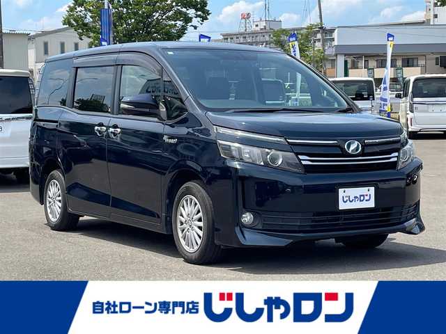 トヨタ ヴォクシー ハイブリッド V 宮城県 2015(平27)年 13.8万km ブラッキッシュアゲハガラスフレーク (株)IDOMが運営する【じしゃロン仙台店】の自社ローン専用車両になりますこちらは現金またはオートローンご利用時の価格です。自社ローンご希望の方は別途その旨お申付け下さい/パワースライドドア/SDナビ/フリップダウンモニター/フルセグ/Bluetooth/CD/DVD/バックカメラ/ETC/クルコン/ドラレコ/Qi充電/LEDヘッドライト