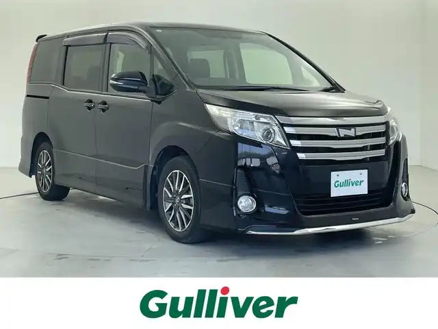 トヨタ ノア Si 福井県 2015(平27)年 5.7万km ブラック 純正SDナビ/ＣＤ　ＤＶＤ　Ｂｌｕｅｔｏｏｔｈ　/フルセグＴＶ　ＦＭ　ＡＭ　ＳＤ　/バックカメラ　/MTモード付きAT/両側パワースライドドア　/ビルトインＥＴＣ　/モデリスタエアロ/マフラーカッター/純正AW/オートライト