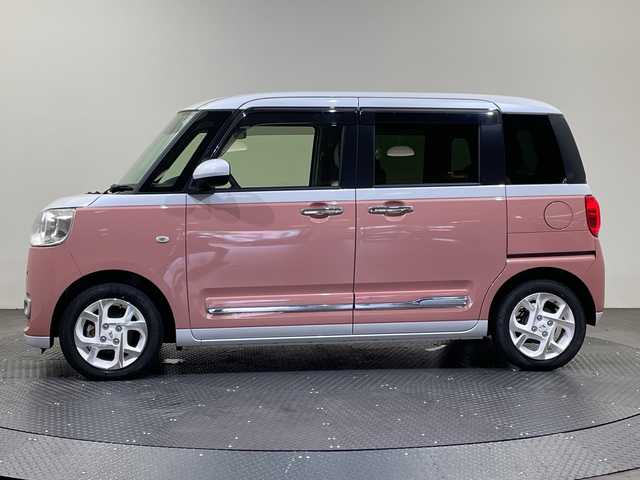 ダイハツ ムーヴ キャンバス ストライプス G 愛媛県 2022(令4)年 0.9万km シャイニングホワイトパール/アプリコットピンクメタリック １０型ナビ/フルセグ／Ｂｌｕｅｔｏｏｔｈ／ＵＳＢ/全方位カメラ/前方ドライブレコーダー/ＤＮ席シートヒーター/両側パワースライドドア/前後コーナーセンサー/ＬＥＤヘッドライト/衝突軽減ブレーキ