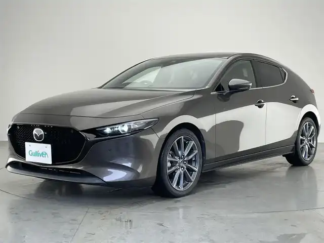 マツダ マツダ３ファストバック 20S バーガンディセレクション 愛知県 2019(令1)年 5.8万km チタニウムフラッシュマイカ 純正８．８型ディスプレイオーディオ　フルセグＴＶ　ＨＤＭＩ　アラウンドビューモニター　赤革　レーダークルコン　シートヒーター　ステアリングヒーター　ドラレコ　ＢＳＭ　ＨＵＤ　ＬＥＤオートライト　禁煙車