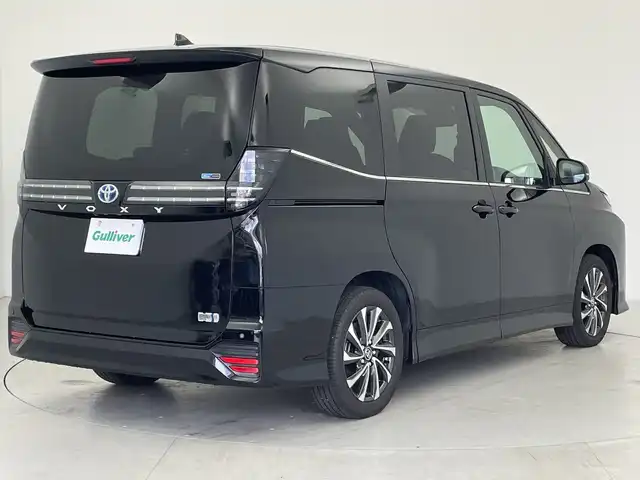トヨタ ヴォクシー ハイブリッド S－Z 愛知県 2025(令7)年 0.1万km アティチュードブラックマイカ 純正１０．５型ディスプレイオーディオ/・Bluetooth/・CD/DVD/・フルセグテレビ/・HDMI/バックカメラ/快適利便パッケージ/・パワーバックドア/・後席シートヒーター/・オットマン/・電動リアゲート/・ハンズフリーデュアルパワースライドドア/衝突軽減ブレーキ/レーンキープアシスト/オートマチックハイビーム/ビルトインETC2.0/ハーフレザーシート/フロアマット