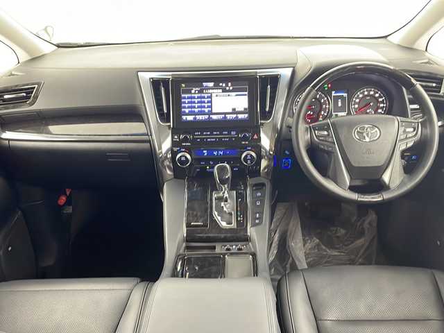 トヨタ ヴェルファイア Z Gエディション 熊本県 2018(平30)年 8万km ホワイトパールクリスタルシャイン ＪＢＬプレミアムサウンド　/駐車支援システム　/メーカー純正ナビ/CD/DVD/ Bluetooth/SD/AM/FM/フリップダウンモニター/バックカメラ/前方ドライブレコーダー　/サンルーフ　/1.2列目パワーシート/前席シートヒーターシートクーラー/オットマン/革巻きステアリング/ステアリングヒーター/ステアリングリモコン/革シート/エアシート　/シートヒーター　/クルーズコントロール　/社外エアロ　/社外サス/純正AW/純正フロアマット/純正ドアバイザー/スマートキー/スペアキー×１