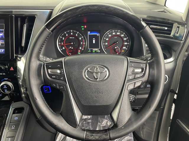 トヨタ ヴェルファイア Z Gエディション 熊本県 2018(平30)年 8万km ホワイトパールクリスタルシャイン ＪＢＬプレミアムサウンド　/駐車支援システム　/メーカー純正ナビ/CD/DVD/ Bluetooth/SD/AM/FM/フリップダウンモニター/バックカメラ/前方ドライブレコーダー　/サンルーフ　/1.2列目パワーシート/前席シートヒーターシートクーラー/オットマン/革巻きステアリング/ステアリングヒーター/ステアリングリモコン/革シート/エアシート　/シートヒーター　/クルーズコントロール　/社外エアロ　/社外サス/純正AW/純正フロアマット/純正ドアバイザー/スマートキー/スペアキー×１