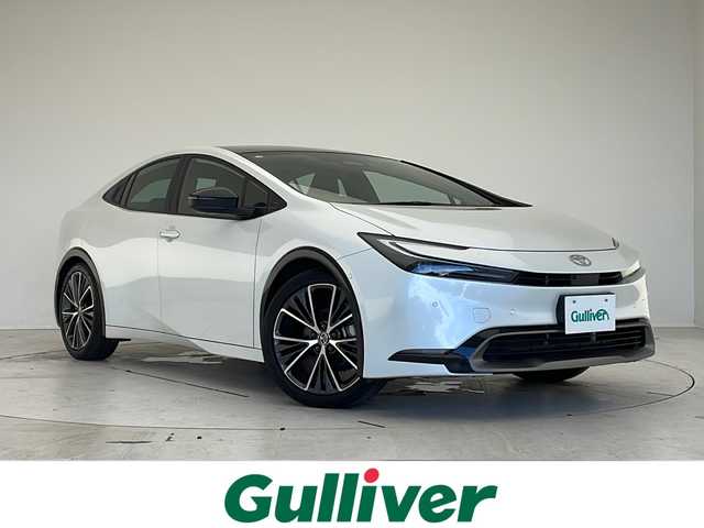 トヨタ プリウス Z 愛知県 2023(令5)年 2.9万km プラチナホワイトパールマイカ 衝突軽減システム/純正12.3型ディズプレイオーディオ　ナビ機能なし/全方位カメラ/ガラスルーフ/レーダークルーズコントロール/シートヒーター/エアシート/フルセグ/Bluetooth/バックカメラ/電動リアゲート/パワーシート/コーナーセンサー/純正アルミホイール/ETC2.0/ブラインドスポットモニター/LEDヘッドライト/ステアリングヒーター/インテリジェントミラー/オートマチックハイビーム/置くだけ充電機/ステアリングスイッチ/スマートキー/プッシュスタート