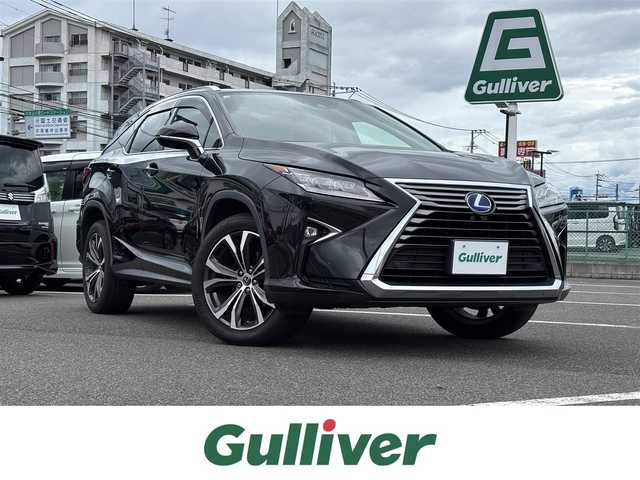 レクサス ＲＸ 450hL 大分県 2018(平30)年 6.6万km グラファイトブラックガラスフレーク ・純正ナビ(CD.DVD.BT.SD.AUX.USB)/・全方位カメラ/・フルセグテレビ/・ヘッドアップディスプレイ/・三眼ヘッドライト/・AC100V/・プリクラッシュセーフティ/・ブラインドスポットモニター/・コーナーセンサー/・ETC 2.0/・パワーシート/・シートヒーター＆シートクーラー/・オートハイビーム/・ブレーキホールド/・ステアリングリモコン/・ハンドルヒーター/・電動格納サードシート/・電動リアゲート