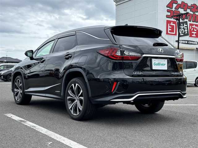 レクサス ＲＸ 450hL 大分県 2018(平30)年 6.6万km グラファイトブラックガラスフレーク ・純正ナビ(CD.DVD.BT.SD.AUX.USB)/・全方位カメラ/・フルセグテレビ/・ヘッドアップディスプレイ/・三眼ヘッドライト/・AC100V/・プリクラッシュセーフティ/・ブラインドスポットモニター/・コーナーセンサー/・ETC 2.0/・パワーシート/・シートヒーター＆シートクーラー/・オートハイビーム/・ブレーキホールド/・ステアリングリモコン/・ハンドルヒーター/・電動格納サードシート/・電動リアゲート