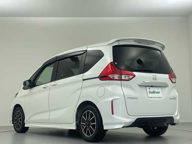 ホンダ フリード モデューロX ホンダセンシング 大阪府 2018(平30)年 5.2万km ホワイトオーキッドパール 純正９型ナビ　フルセグＴＶ　前後ドライブレコーダー　ビルトインＥＴＣ　バックカメラ　両側パワースライドドア　ＬＥＤヘッドライト　フォグランプ　純正１５インチＡＷ　純正フロアマット　スマートキー　禁煙車