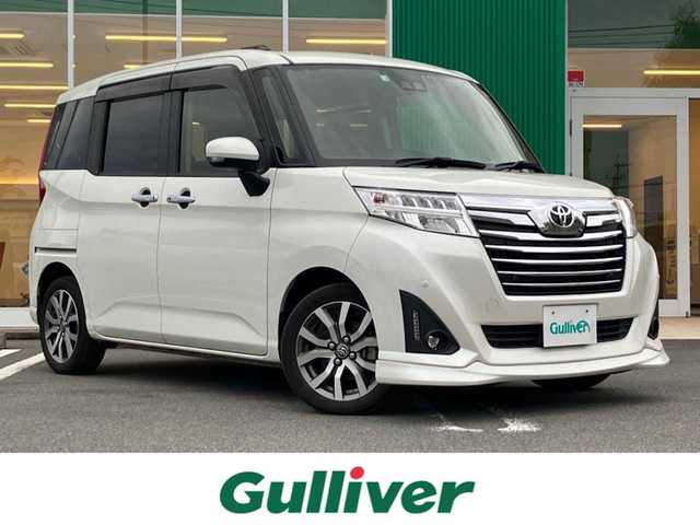 トヨタ ルーミー カスタムG－T 静岡県 2020(令2)年 4.3万km パールホワイトⅢ エンジンスタートボタン/パワーステアリング/パワーウィンドウ/アイドリングストップ/スマートキー/スペアキー１本/オートエアコン/クルーズコントロール/ETC2.0/バックカメラ/純正9インチナビ（CD.BT.フルセグ）/ドライブレコーダー/ウォークスルー/純正フロアマット/純正アルミホイール/D席N席シートヒーター/両側パワースライドドア/ABS/横滑り防止装置/コーナーセンサー前後/オートライト/オートマチックハイビーム/LEDライト/Wエアバック/衝突軽減システム