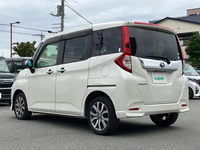 トヨタ ルーミー カスタムG－T 静岡県 2020(令2)年 4.3万km パールホワイトⅢ エンジンスタートボタン/パワーステアリング/パワーウィンドウ/アイドリングストップ/スマートキー/スペアキー１本/オートエアコン/クルーズコントロール/ETC2.0/バックカメラ/純正9インチナビ（CD.BT.フルセグ）/ドライブレコーダー/ウォークスルー/純正フロアマット/純正アルミホイール/D席N席シートヒーター/両側パワースライドドア/ABS/横滑り防止装置/コーナーセンサー前後/オートライト/オートマチックハイビーム/LEDライト/Wエアバック/衝突軽減システム