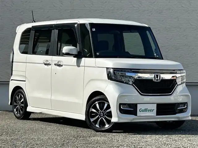 ホンダ Ｎ ＢＯＸ カスタム G L ホンダセンシング 大阪府 2020(令2)年 7万km プラチナホワイトパール ワンオーナー/純正メモリナビ（VXM-204UFi）/BT/CD/DVD/フルセグTV/バックカメラ/前席シートヒーター/片側パワースライドドア/カーテンエアバック/コーナーセンサー/レーンキープアシスト/LEDヘッドライト/後席ロールサンシェード/USB充電ポート/純正フロアマット/スペアキー/ドライブレコーダー/ETC