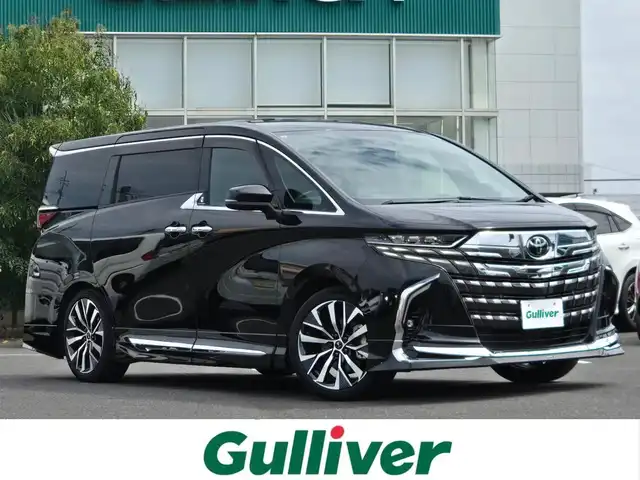 トヨタ アルファードハイブリット Z 鹿児島県 2023(令5)年 3.3万km ブラック モデリスタシグネイチャーイルミブレード　/モデリスタエアロ　/モデリスタ専用アルミホイール（２０インチ）　/左右独立ムーンルーフ　/デジタルインナーミラー　/前後ドライブレコーダー　/トヨタチームメイト/ビルトインETC2.0/カラーヘッドアップディスプレイ/プロジェクションカーテンイルミ/パノラミックビューモニター/CPCプレミアムコーティング/後席フリップダウンモニター/純正ディスプレイオーディオ/Bluetoothオーディオ/フルセグテレビ(TVキャンセラー付)/全席パワーシート/全席シートヒーター/全席シートベンチレーション/ステアリングヒーター/パワーバックドア/プッシュスタート/スマートキー