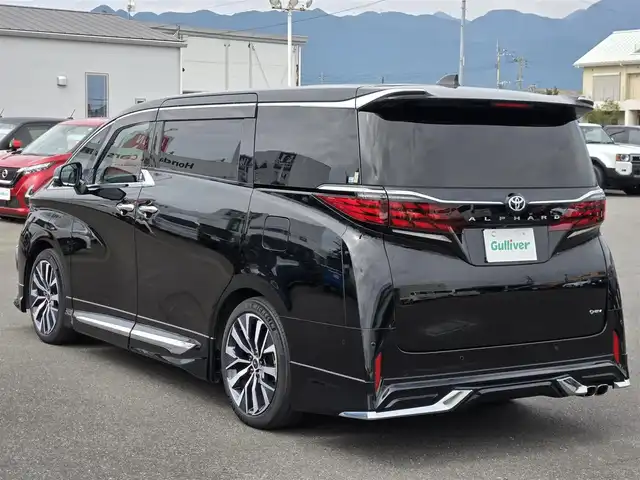トヨタ アルファードハイブリット Z 鹿児島県 2023(令5)年 3.3万km ブラック モデリスタシグネイチャーイルミブレード　/モデリスタエアロ　/モデリスタ専用アルミホイール（２０インチ）　/左右独立ムーンルーフ　/デジタルインナーミラー　/前後ドライブレコーダー　/トヨタチームメイト/ビルトインETC2.0/カラーヘッドアップディスプレイ/プロジェクションカーテンイルミ/パノラミックビューモニター/CPCプレミアムコーティング/後席フリップダウンモニター/純正ディスプレイオーディオ/Bluetoothオーディオ/フルセグテレビ(TVキャンセラー付)/全席パワーシート/全席シートヒーター/全席シートベンチレーション/ステアリングヒーター/パワーバックドア/プッシュスタート/スマートキー