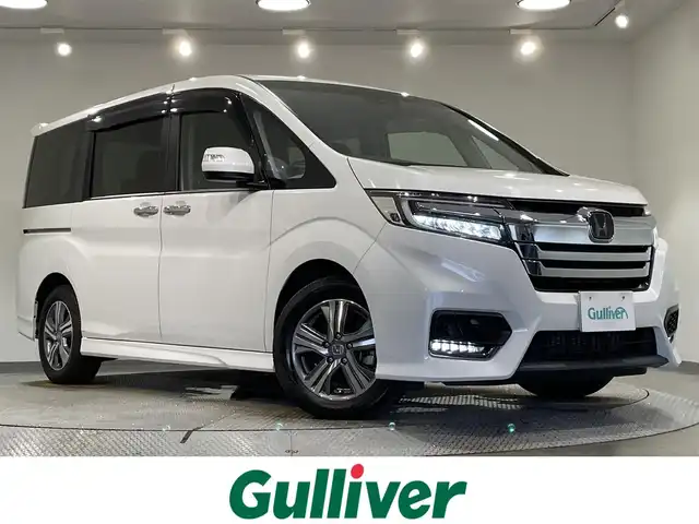 ホンダ ステップワゴン スパーダ eHEV G EXホンダS 愛知県 2020(令2)年 2.5万km プラチナホワイトパール 純正１０インチナビ　/(Bluetooth/フルセグTV/CD・DVD再生/SD/FM/AM)/純正フリップダウンモニター　/ＤＩＡＴＯＮＥサウンド　/ホンダセンシング　/　　-衝突軽減ブレーキ/　　-誤発進抑制機能/　　-路外逸脱抑制機能/　　-アダプティブ・クルーズ・コントロール/　　-車線維持支援システム/　　-先行車発進お知らせ機能/　　-標識認識機能/　　-両側パワースライドドア　/シートヒーター　/ビルトインＥＴＣ２．０　/バックカメラ/前後ドライブレコーダー　/ＬＥＤヘッドライト/LEDフォグランプ/ＵＳＢ接続/プッシュスタート/　　スマートキー/純正フロアマット