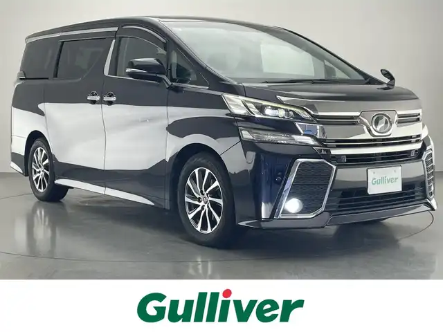 トヨタ ヴェルファイア Z Aエディション 愛知県 2016(平28)年 10.1万km スパークリングブラックパールクリスタルシャイン 社外９型ナビ　１０型後席モニター　禁煙車　ＡＣ１００Ｖ　フルセグＴＶ　ＤＶＤ　Ｂｌｕｅｔｏｏｔｈ　オットマン　両側パワスラ　ＥＴＣ　前後ドラレコ　バックカメラ　追従クルコン　ＬＥＤオートライト　フォグ　衝突軽減 コーナーセンサー USB　スマートキー 純正フロアマット 純正17インチAW　スペアタイヤ