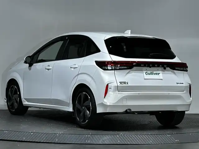 日産 オーラ G レザーエディション 愛媛県 2023(令5)年 1.4万km ピュアホワイトパール メーカーナビ/(Bluetooth/HDMI)/プロパイロット/インテリジェントルームミラー/全周囲カメラ/BOSEサウンド/ワイヤレス充電/ステアリングヒーター/シートヒーター/純正ドライブレコーダー/ETC2.0/衝突被害軽減ブレーキ/コーナーセンサー/ブラインドスポットモニター/オートマチックハイビーム/オートライト/フォグランプ/スペアキー/保証書
