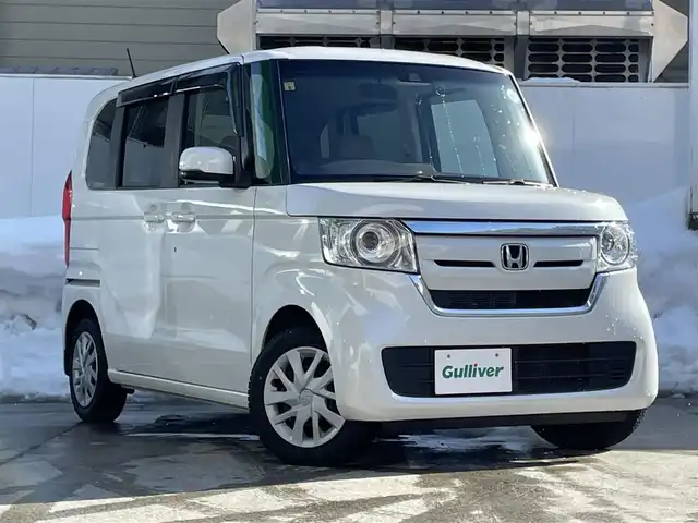 ホンダ Ｎ ＢＯＸ G L ホンダセンシング 青森県 2020(令2)年 3.9万km プラチナホワイトパール ワンオーナー/4WD/純正8インチナビ/【AM/FM/フルセグTV/SD/CD/DVD/BT】/バックカメラ/ホンダセンシング/・衝突被害軽減ブレーキ/・誤発進抑制機能/・歩行者事故低減ステアリング/・先行車発信お知らせ機能/・標識認識機能/・路外逸脱抑制機能/・クルーズコントロール/・車線維持支援システム/オートハイビーム/片側パワースライドドア/エンジンスターター/ETC/後席会話機能/積込　夏タイヤ　155/65R14　20年製/装着　冬タイヤ　155/65R14　19年製/保証書/取扱説明書