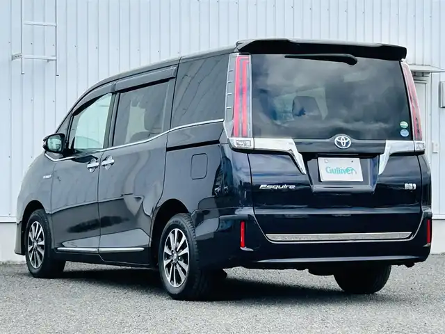 トヨタ エスクァイア ハイブリッド Xi 熊本県 2019(平31)年 3.3万km スパークリングブラックパールクリスタルシャイン 純正SDナビDTV/・AM/FM/CD/DVD/BT/AUX/・地デジ/バックカメラ/両側パワースライドドア/トヨタセーフティセンス/・プリクラッシュセーフティ/・レーントレーシングアシスト/・クリアランスソナー/・パーキングサポートブレーキ/・ロードサインアシスト/クルーズコントロール/EV/ECO/PWRMODE/オートハイビーム/フォグランプ/電動格納・ウィンカーミラー/LEDライト/アイドリングストップ/USB充電（フロント、2列目）/シートヒーター（DN）/デュアルエアコン/リアクーラー/プッシュスタート/ロールシェード/革巻きステアリング/ステアリングスイッチ/スマートキー