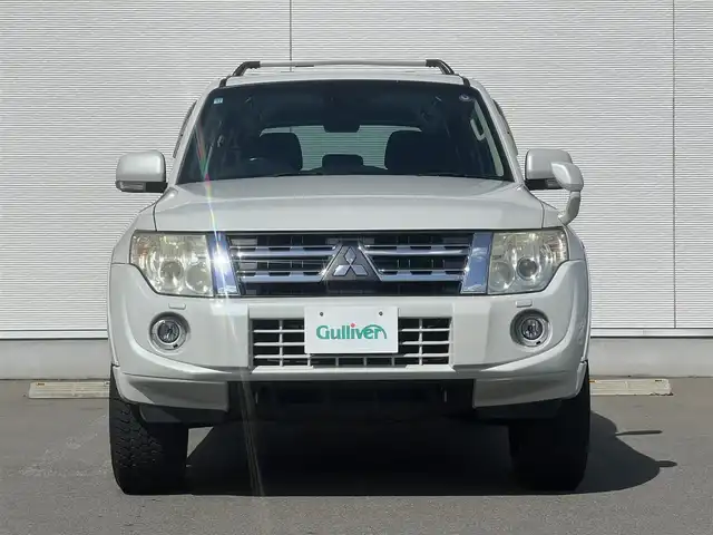 三菱 パジェロ ロング エクシード 秋田県 2012(平24)年 13.4万km ウォームホワイトパール ４WD/ターボ/社外メモリナビ/フルセグ/バックカメラ/社外17インチアルミ（夏タイヤ装着）/MTモード付AT/クルーズコントロール追従走行無/ステアリングスイッチ/前席シートヒーター/センターデフロック/ビルトインETC/ディーゼル微粒子フィルター/ルーフキャリア/ヒッチメンバー/100V充電/純正フロアマット/純正ドアバイザー/オートライト/オートエアコン/パワーステアリング/パワーウィンドウ/横滑り防止/盗難防止装置/電動格納ウィンカーミラー/キーレスエントリー/保証書/取扱説明書/記録簿