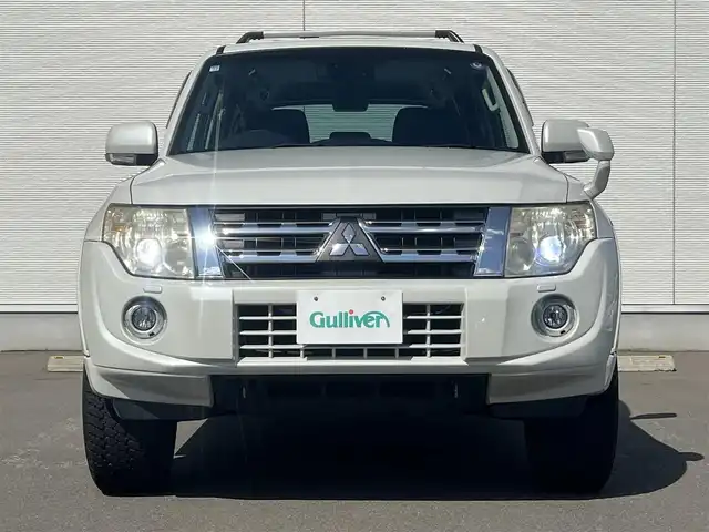 三菱 パジェロ ロング エクシード 秋田県 2012(平24)年 13.4万km ウォームホワイトパール ４WD/ターボ/社外メモリナビ/フルセグ/バックカメラ/社外17インチアルミ（夏タイヤ装着）/MTモード付AT/クルーズコントロール追従走行無/ステアリングスイッチ/前席シートヒーター/センターデフロック/ビルトインETC/ディーゼル微粒子フィルター/ルーフキャリア/ヒッチメンバー/100V充電/純正フロアマット/純正ドアバイザー/オートライト/オートエアコン/パワーステアリング/パワーウィンドウ/横滑り防止/盗難防止装置/電動格納ウィンカーミラー/キーレスエントリー/保証書/取扱説明書/記録簿