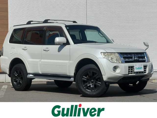 三菱 パジェロ ロング エクシード 秋田県 2012(平24)年 13.4万km ウォームホワイトパール ４WD/ターボ/社外メモリナビ/フルセグ/バックカメラ/社外17インチアルミ（夏タイヤ装着）/MTモード付AT/クルーズコントロール追従走行無/ステアリングスイッチ/前席シートヒーター/センターデフロック/ビルトインETC/ディーゼル微粒子フィルター/ルーフキャリア/ヒッチメンバー/100V充電/純正フロアマット/純正ドアバイザー/オートライト/オートエアコン/パワーステアリング/パワーウィンドウ/横滑り防止/盗難防止装置/電動格納ウィンカーミラー/キーレスエントリー/保証書/取扱説明書/記録簿