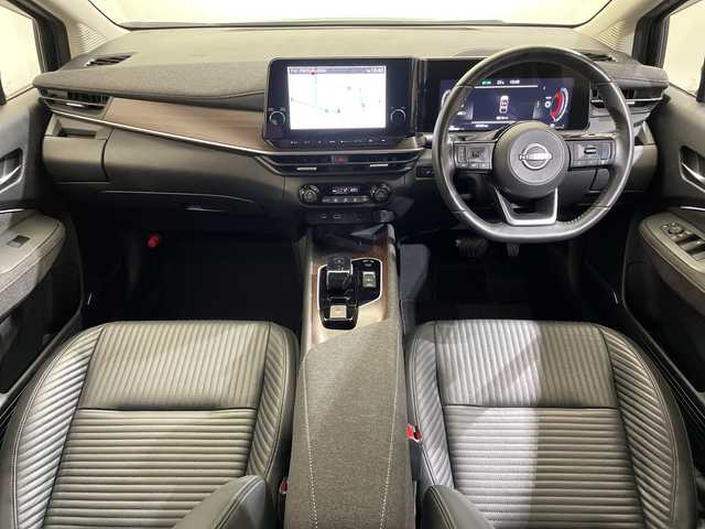 日産 オーラ G レザーエディション 愛媛県 2023(令5)年 2.1万km ミッドナイトブラック/サンライズカッパー ９型ナビ/フルセグ／Ｂｌｕｅｔｏｏｔｈ／ＵＳＢ/全方位カメラ/プロパイロット/衝突軽減ブレーキ/ＥＴＣ２．０/前方ドライブレコーダー/レーダークルーズコントロール/レーンキープアシスト/ブラインドスポットモニター/前後コーナーセンサー/オートマチックハイビーム/レザーシート/LEDヘッドライト