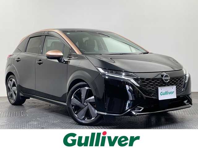 日産 オーラ G レザーエディション 愛媛県 2023(令5)年 2.1万km ミッドナイトブラック/サンライズカッパー ９型ナビ/フルセグ／Ｂｌｕｅｔｏｏｔｈ／ＵＳＢ/全方位カメラ/プロパイロット/衝突軽減ブレーキ/ＥＴＣ２．０/前方ドライブレコーダー/レーダークルーズコントロール/レーンキープアシスト/ブラインドスポットモニター/前後コーナーセンサー/オートマチックハイビーム/レザーシート/LEDヘッドライト