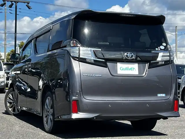 トヨタ ヴェルファイア 3.5ZA ゴールデンアイズ 道央・札幌 2016(平28)年 7.7万km グレーメタリック ４WD/純正SDナビ/AM/FM/BT/CD/DVD/フルセグ/純正フリップダウンモニター/衝突被害軽減ブレーキ/横滑り防止装置/レーダークルーズコントロール/クリアランスソナー/バックカメラ/ビルトインETC/ECOMODE/両側パワースライドドア/パワーバックドア/オットマン/ハーフレザーシート/革巻きウッドコンビステアリング/ステアリングリモコン/AC100V/電動パーキング/ブレーキホールド/MTモード付AT/プッシュスタート/スマートキー/LEDヘッドライト/オートライト/フォグランプ/電動格納ミラー/ウィンカーミラー/純正フロアマット/ドアバイザー